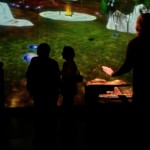 mellifera : viewers interact immersed within a ten metre projection of the live virtual environment